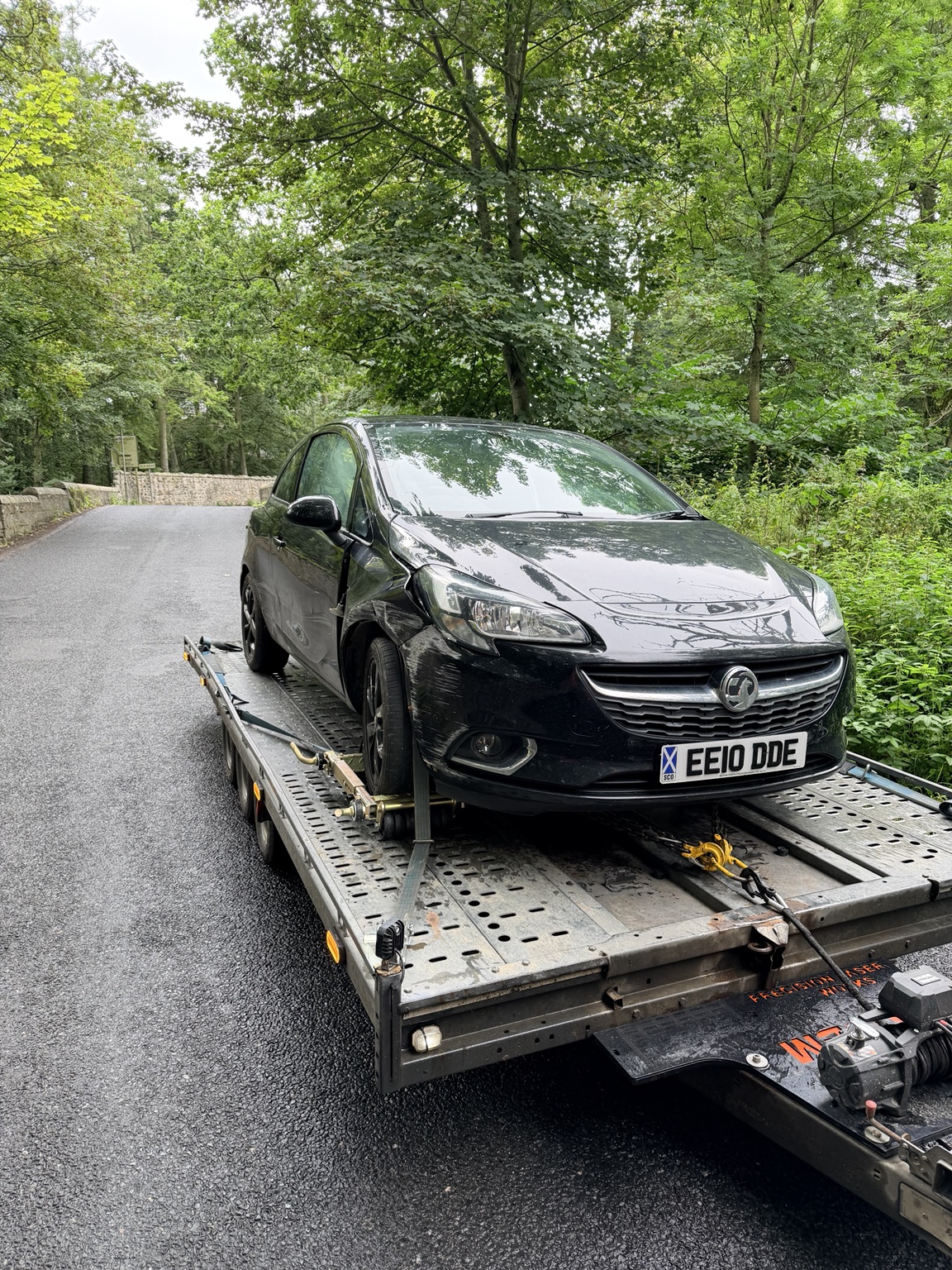 Accident-damaged Vauxhall Corsa secured on DSBM’s transporter