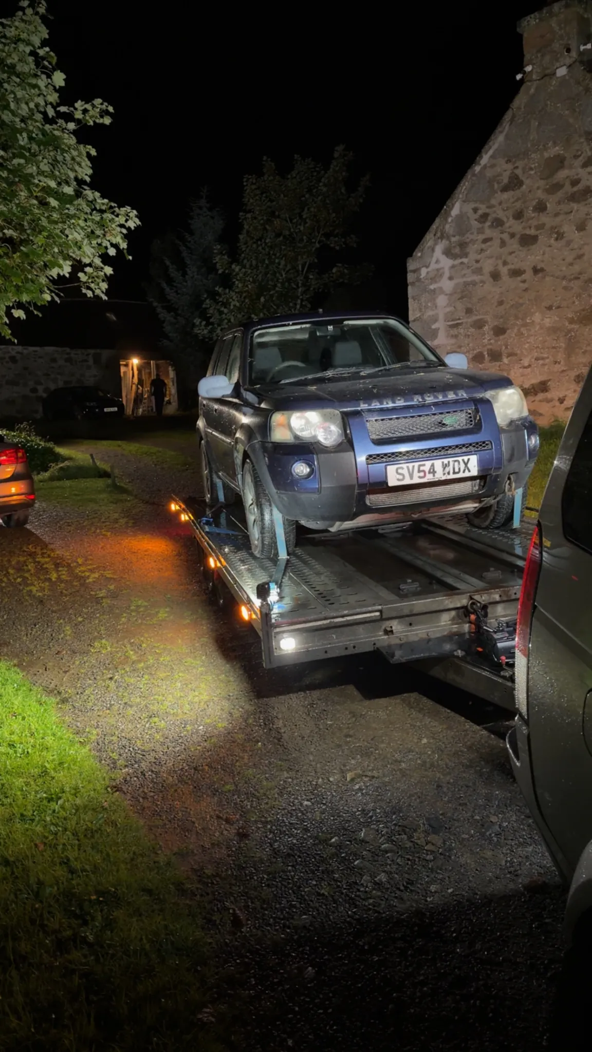 Land Rover Freelander recovered on the DSBM trailer at night